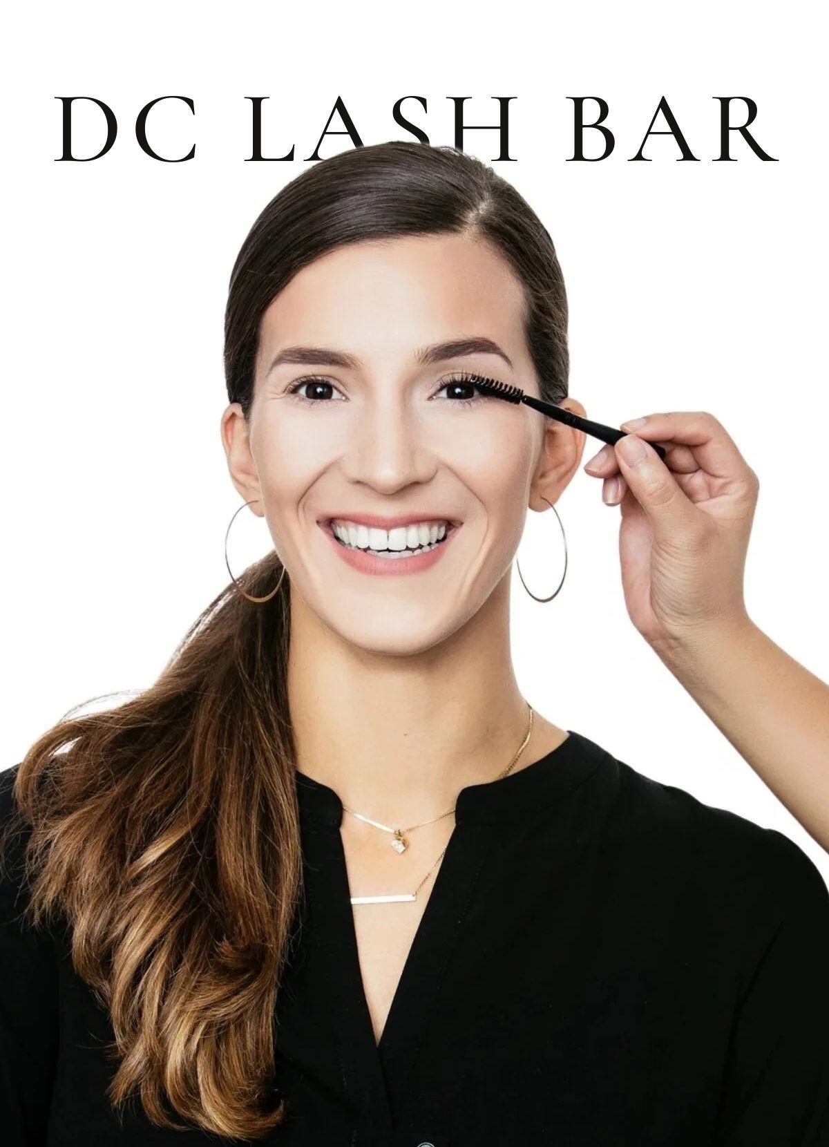 DC Lash Bar. A smiling guest having her lashes brushed.